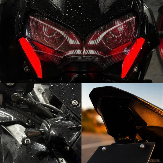 Faro con vinilos de ojos rojos y trasera oscurecida de una Kawasaki Z900 al atardecer